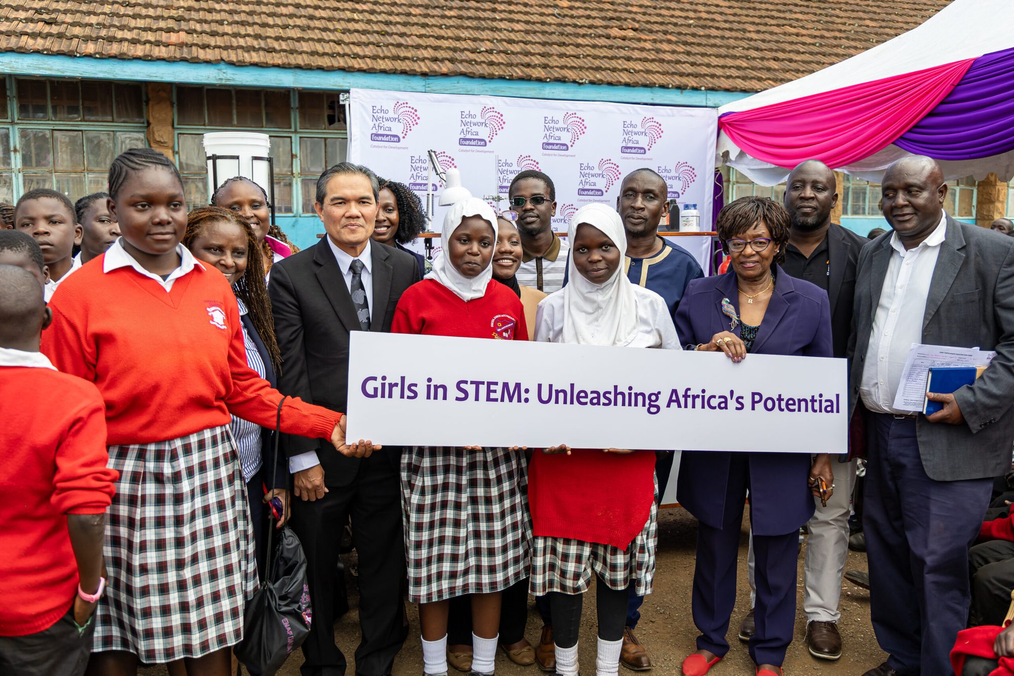 Students and partners gather at the Girls in STEM Mobile Science Lab handover at Kibera Primary School