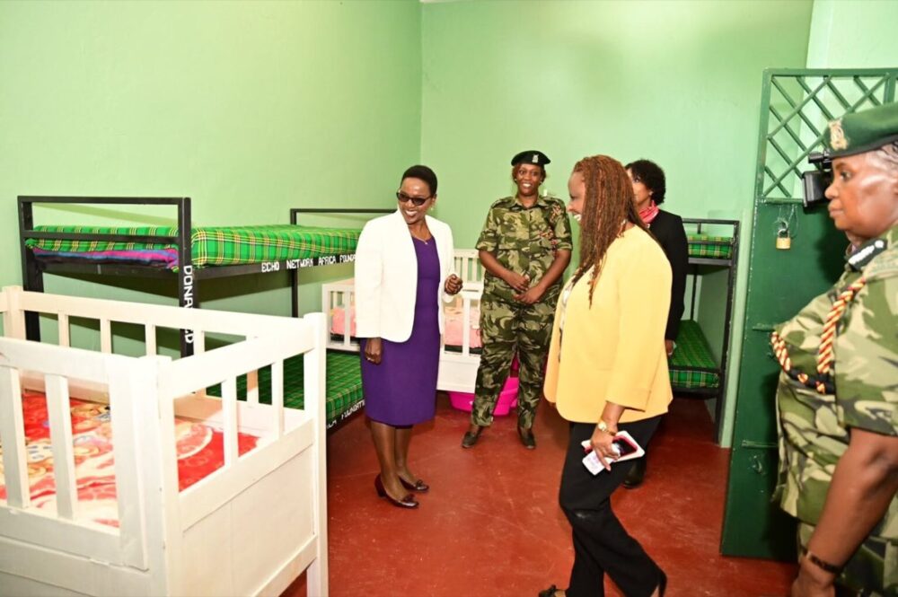 Dr. Jennifer Riria and prison officers tour a refurbished mother-and-baby room at Murang’a Women’s Prison
